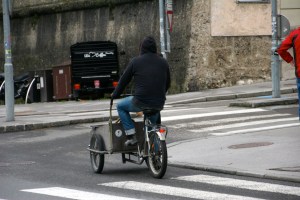 Tail end view of the poop scoop man and his modified bicycle